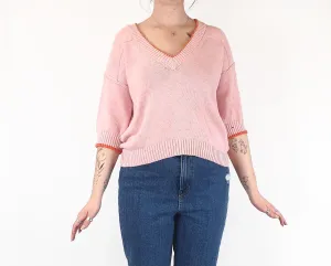 Pink half sleeve knit with orange trim fits size 12